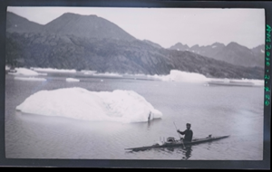 Image: Kayaker near small iceberg